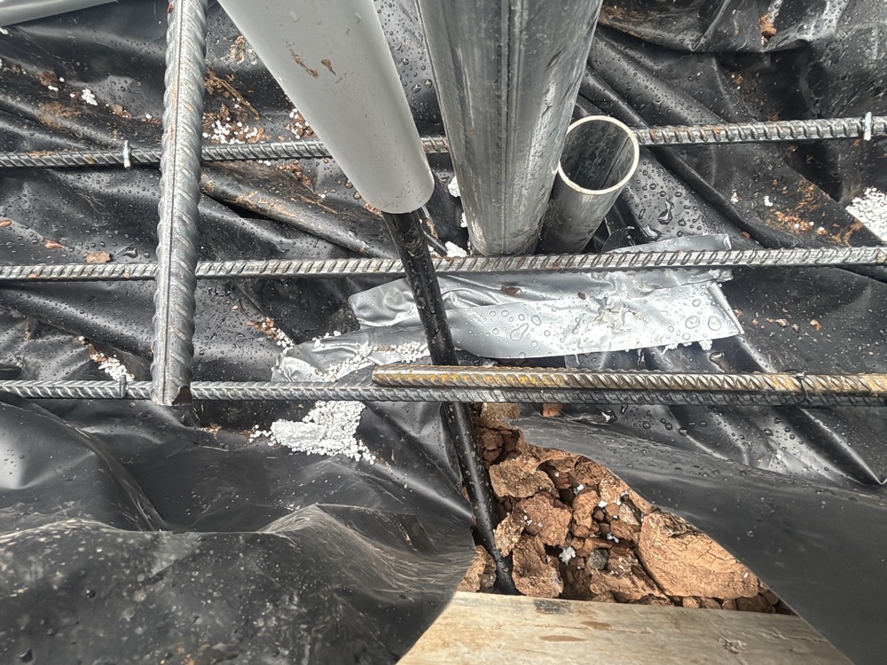 Punctures in the vapour barrier left unsealed, recorded during a slab pre-pour inspection in Fraser Rise, 4 km from Rockbank