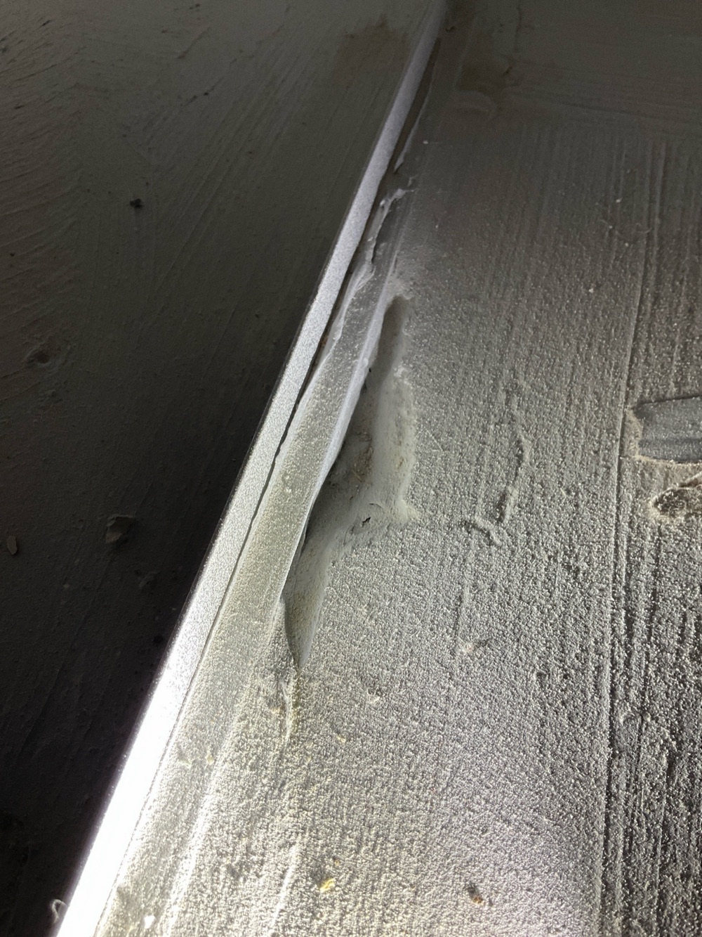 Divots in the shower screed that will pond water, recorded during a pre-handover inspection in Fraser Rise, 4 km from Rockbank